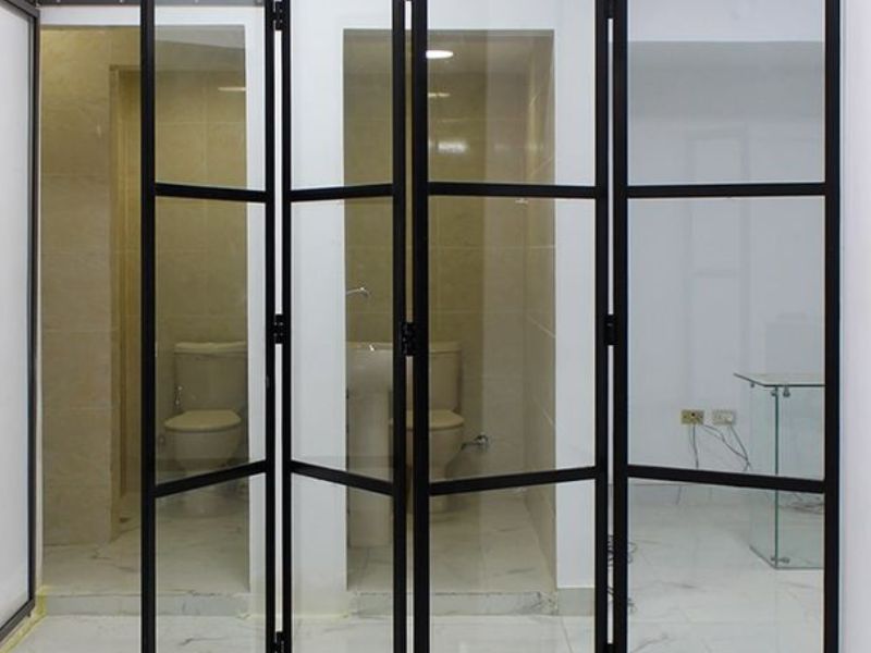 Elegant frameless folding doors by Prime Glass & Aluminium – seamless and space-saving glass doors for a modern, open-concept design.